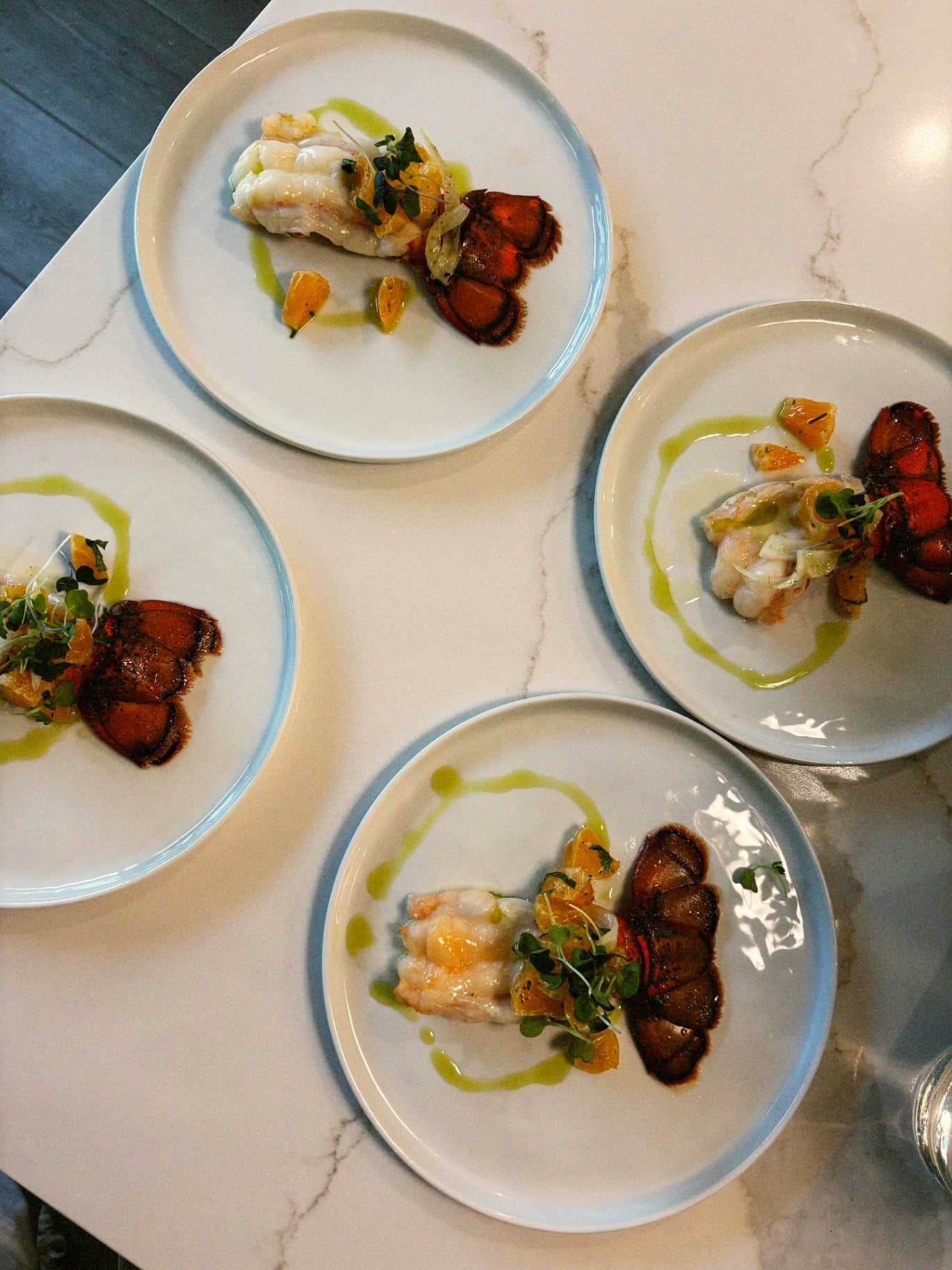 Butter-poached lobster plated for a Luma Society dinner